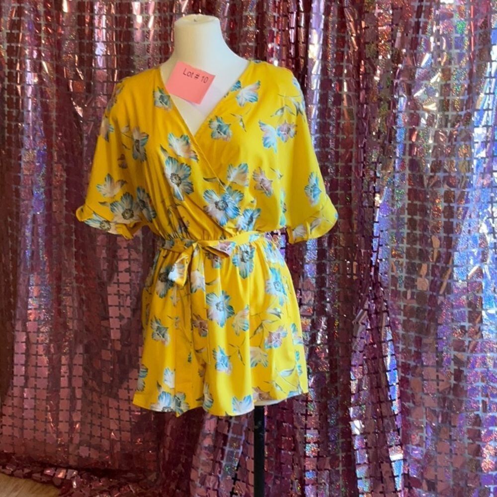 NWOT Romper in size medium by CHARLOTTE RUSSE in bright yellow with flowers